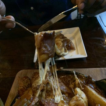 Bosscat Kitchen & Libations - Cheesy goodness and gravy...mmm Pork Belly Poutine - New American Near Me - Houston, Texas Bosscat Kitchen & Libations - Cheesy goodness and gravy...mmm Pork Belly Poutine - New American Near Me - Houston, Texas