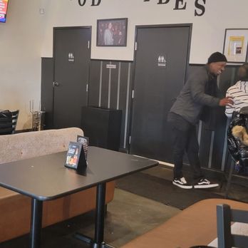 Good Vibes Lounge - a man playing ping - pong - Lounges Near Me - Detroit, Michigan