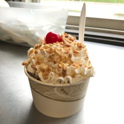 Jimmie's Ice Cream & Grill - Ice cream sundae made with soft serve ice cream topped with hot fudge, nuts, whipped cream, and a cherry!