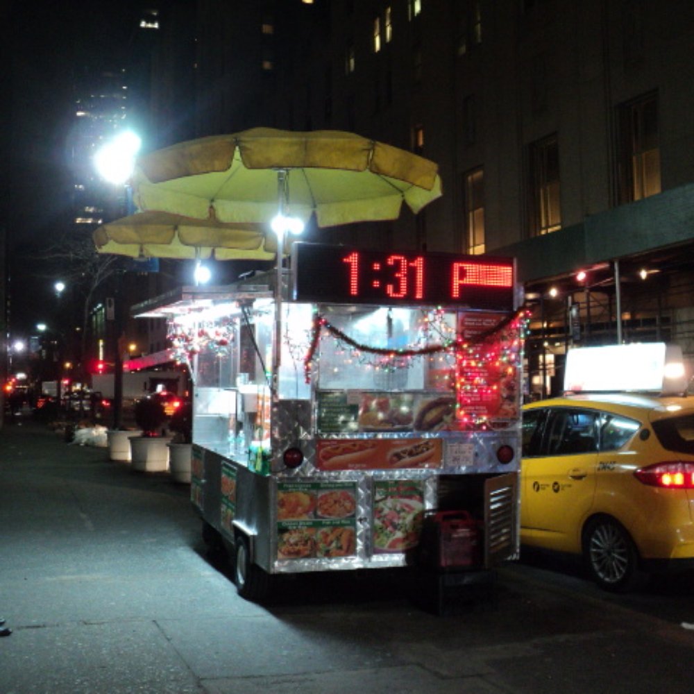 Halal Cart - a food cart on a city street at night - Food Trucks Near Me - New York, New York Halal Cart - a food cart on a city street at night - Food Trucks Near Me - New York, New York