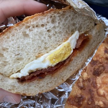 Manhattan Bagel - Above is an Asiago roll with "over hard egg and bacon." They call this an egg sandwich?!? - Bagels Near Me - Toms River, New Jersey Manhattan Bagel - Above is an Asiago roll with "over hard egg and bacon." They call this an egg sandwich?!? - Bagels Near Me - Toms River, New Jersey