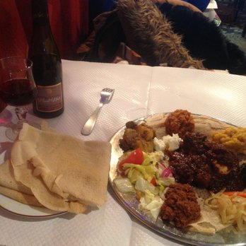 Ethiopia - The very generous and delicious sampler platter for one plus my half bottle of wine. - Ethiopian Near Me - Paris, 75 Ethiopia - The very generous and delicious sampler platter for one plus my half bottle of wine. - Ethiopian Near Me - Paris, 75
