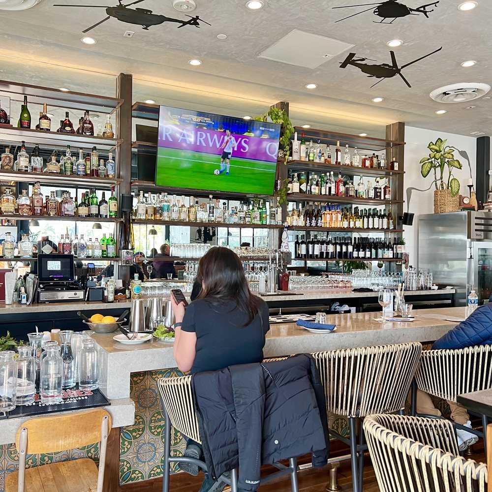 Little Sister - a woman sitting at a bar - Vietnamese Near Me - El Segundo, California Little Sister - a woman sitting at a bar - Vietnamese Near Me - El Segundo, California
