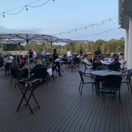 Outdoor dining, beautiful overlooking a lake.
