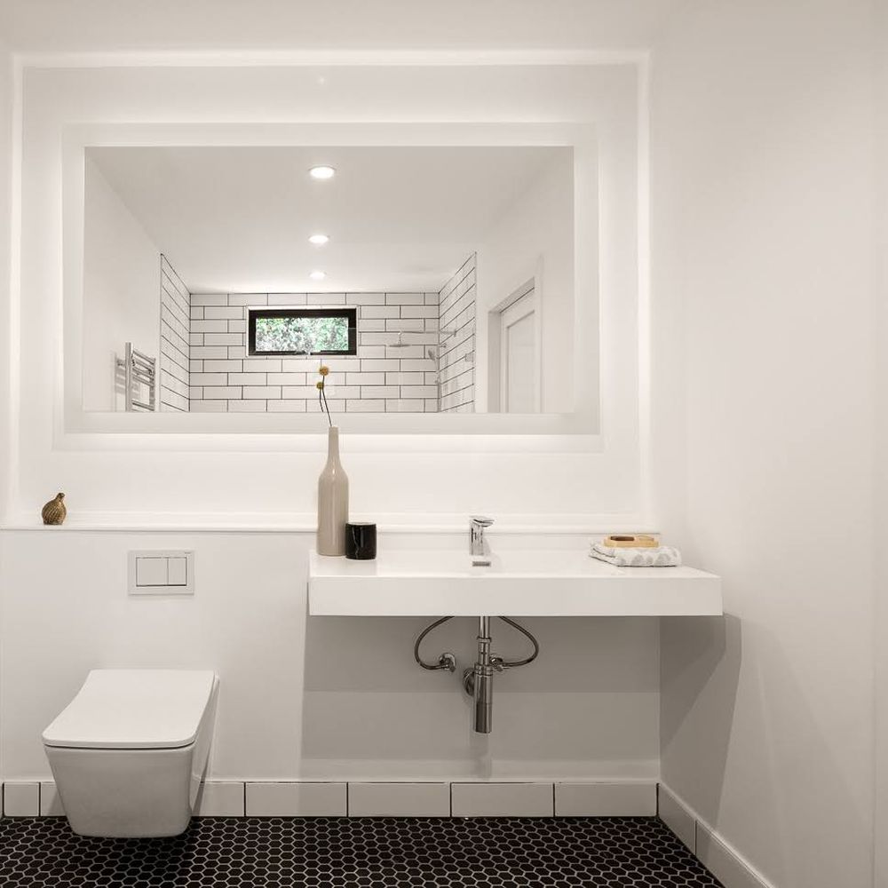 SplashWorks - Large LED mirror, wall-hung toilet, sink, faucet, and p-trap sourced from Splashworks. - Kitchen & Bath Near Me - San Jose, California SplashWorks - Large LED mirror, wall-hung toilet, sink, faucet, and p-trap sourced from Splashworks. - Kitchen & Bath Near Me - San Jose, California