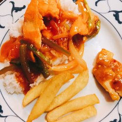 Amber Restaurant - Mixture of chicken fillets in Peking sauce, Szechuan chicken, some chips and boiled rice.