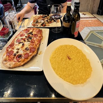 Motta - Right: Risotto allo zafferano ($18) , left: pizza diavola ($16) - Cafes Near Me - Milan, Michigan