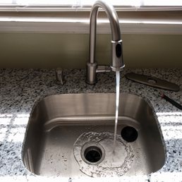 This is the kitchen faucet AFTER I re-installed it without the unnecessary plate you can see on the right.