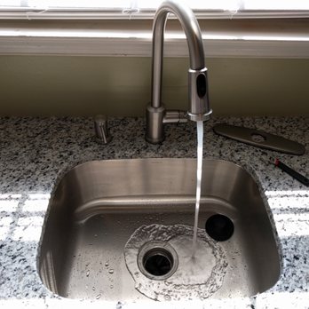 iFixit Handyman Services - This is the kitchen faucet AFTER I re-installed it without the unnecessary plate you can see on the right. - Handyman Near Me