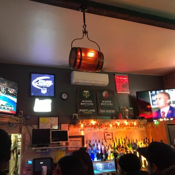 Clodfelter's - a bar with people sitting at the bar - Pubs Near Me - Corvallis, Oregon