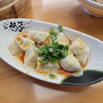 Yuanbao Jiaozi - pork, shrimp, chive & egg dumplings in chili oil - Chinese Near Me - Burlingame, California Yuanbao Jiaozi - pork, shrimp, chive & egg dumplings in chili oil - Chinese Near Me - Burlingame, California