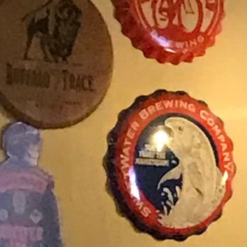 Impellizzeri's - Giant bottle caps at the bar - Pizza Near Me - Elizabethtown, Kentucky Impellizzeri's - Giant bottle caps at the bar - Pizza Near Me - Elizabethtown, Kentucky