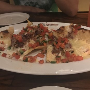 LongHorn Steakhouse - Brisket Nachos after we started eating them lol - Steakhouses Near Me - Goldsboro, North Carolina