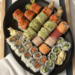Sakura Restaurant - The feast - Hot Babe Roll Tiger Roll  Spicy Tekka Maki Roll  Spicy Hamachi Maki Roll  Avocado and Cucumber Maki Roll  Rainbow Maki Roll
