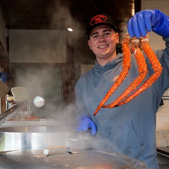 Tracy's King Crab Shack - Tracy's King Crab Shack - Shack 2 - One of the crew holding up 3 legs, freshly steamed Alaskan Red King Crab - Bars Near Me - Juneau, Alaska Tracy's King Crab Shack - Tracy's King Crab Shack - Shack 2 - One of the crew holding up 3 legs, freshly steamed Alaskan Red King Crab - Bars Near Me - Juneau, Alaska