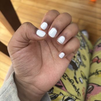 New York Nail Bar - These are my nails currently and I just got my nails done two days ago. Also the jewels aren't even close together as I asked for. - Nail Salons Near Me - Oshkosh, Wisconsin New York Nail Bar - These are my nails currently and I just got my nails done two days ago. Also the jewels aren't even close together as I asked for. - Nail Salons Near Me - Oshkosh, Wisconsin
