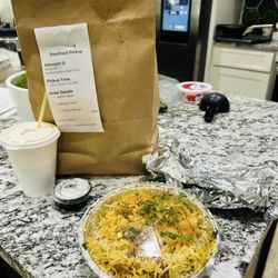 Regular Chicken biryani, butter naan, and mango lassi takeout!