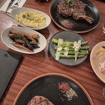 Doris Metropolitan - Sides: Polenta, carrots, asparagus  Bone - in Rib Eye , Cap Off - New American Near Me - New Orleans, Louisiana