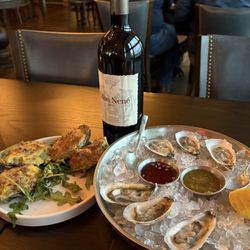Oak Steakhouse - Oysters Rockefeller and oysters on the half shell accompanied by a bottle of Cabernet Sauvignon from Tuscany