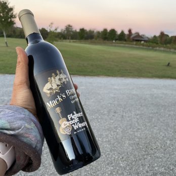 Pickers Creek Winery - a hand holding a bottle of wine - Wineries Near Me - Lewisburg, Tennessee