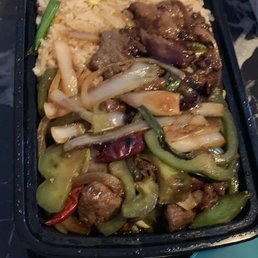 Chewy beef and old tasting rice.