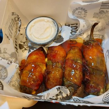 Guy Fieri's Flavortown Kitchen - Bacon wrapped jalapeño poppers with bourbon sauce - Food Delivery Services Near Me Guy Fieri's Flavortown Kitchen - Bacon wrapped jalapeño poppers with bourbon sauce - Food Delivery Services Near Me