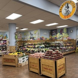 Entranceway with flowers, plants, refrigerated produce Entranceway with flowers, plants, refrigerated produce