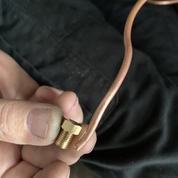 The copper pipe was so bent that the tech could not attach it. Had it been attached before the explosion, it should have been straight.