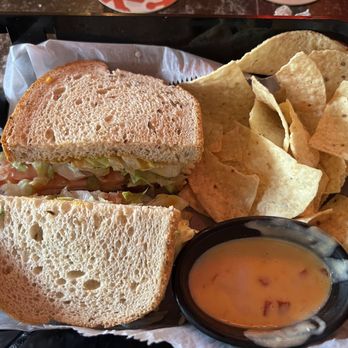 Rock-A-Belly Bar & Deli - Pastrami on Rye with sweet mustard and a side of Chips and Queso. - Delis Near Me - Manhattan, Kansas Rock-A-Belly Bar & Deli - Pastrami on Rye with sweet mustard and a side of Chips and Queso. - Delis Near Me - Manhattan, Kansas