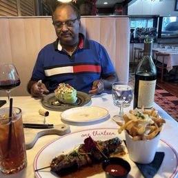 The Steak Kabob with fries and my husband started with Stuffed Wedge Salad and a glass of his favorite wine