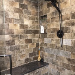 Columbia Showcase Kitchen & Bath Design Studio - interior of bathroom shower with ornate hardware and materials