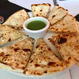 a plate of quesadillas with dipping sauce a plate of quesadillas with dipping sauce