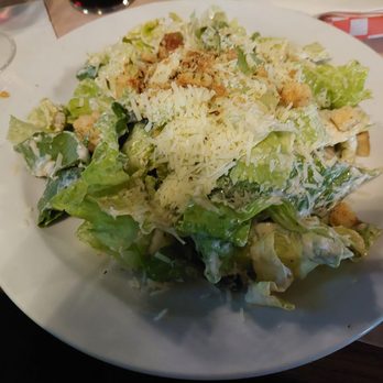 Zambelli - Caesar salad with fresh crispy romaine lettuce and a garlicky dressing. - Steakhouses Near Me - Leduc, Alberta Zambelli - Caesar salad with fresh crispy romaine lettuce and a garlicky dressing. - Steakhouses Near Me - Leduc, Alberta