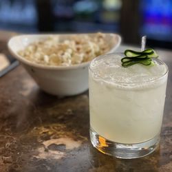 Ocean Prime - Cucumber gimlet with truffle popcorn.