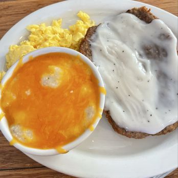 The Hungry Stork - Fried steak two scrambled eggs and cheddar grits. - Breakfast & Brunch Near Me - Longwood, Florida