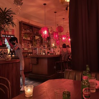 Wei Williamsburg - a woman standing at a bar - Chinese Near Me - Brooklyn, New York Wei Williamsburg - a woman standing at a bar - Chinese Near Me - Brooklyn, New York