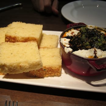 Panzano - Lamb polpettes baked with pomodoro, goat cheese and mint pesto served with gluten free foccacia - Italian Near Me - Denver, Colorado
