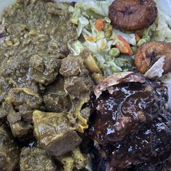 Curry goat jerk chicken cabbage and rice