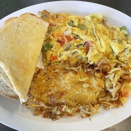 Veggie omelette - comes with hash browns (pictured) or red potatoes, plus a side of toast (sourdough pictured). All delicious!