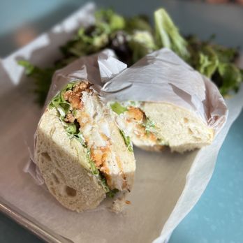 The Bread & Board - Crispy Cajun Fish Sandwich with side salad - Sandwiches Near Me - Jacksonville, Florida