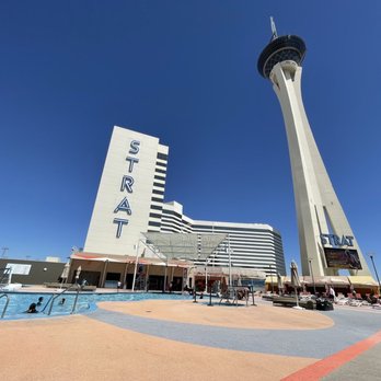 Swim & Social - a view of the sky tower from the pool - Bars Near Me - Las Vegas, Nevada Swim & Social - a view of the sky tower from the pool - Bars Near Me - Las Vegas, Nevada
