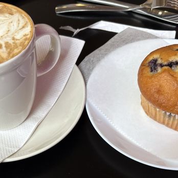 Pangos - Hot Latte with almond milk & a blueberry muffin - Coffee & Tea Near Me - Hopkins, Minnesota Pangos - Hot Latte with almond milk & a blueberry muffin - Coffee & Tea Near Me - Hopkins, Minnesota
