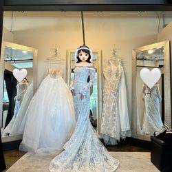 I Do Bridal - View of dressing room for my Premier appt. Example dresses hanging in back + one I tried on (did not buy this one though). Roomy area.