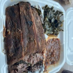 Logan's smoke House - Three Meat Dinner Platter with ribs, brisket, pulled pork, beans and collards.