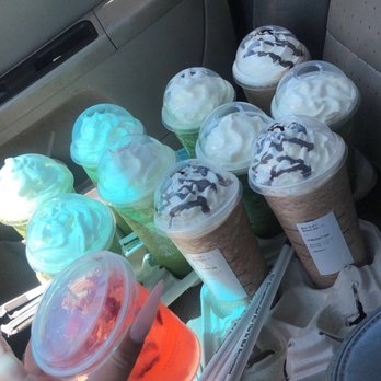 Starbucks - a person holding a cup of ice cream - Coffee & Tea Near Me - Kansas City, Missouri