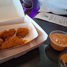 Nuggets with honey rub and dipping sauce. Nuggets with honey rub and dipping sauce.