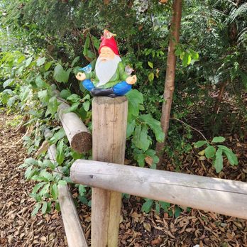 Gnome Forest & Trails - A gnome in "ohm" mode and to also greet you. - Hiking Near Me
