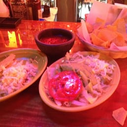 Guacamole salad with beef taco and chips and salsa Guacamole salad with beef taco and chips and salsa