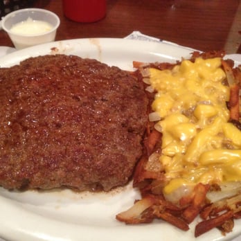 Burns' Grill & Doon Steakhouse - massive hamburger steak with hashbrown potatoes covered in cheese and onions - I had to share with the rest of the table!! - Steakhouses Near Me - Doon, Iowa