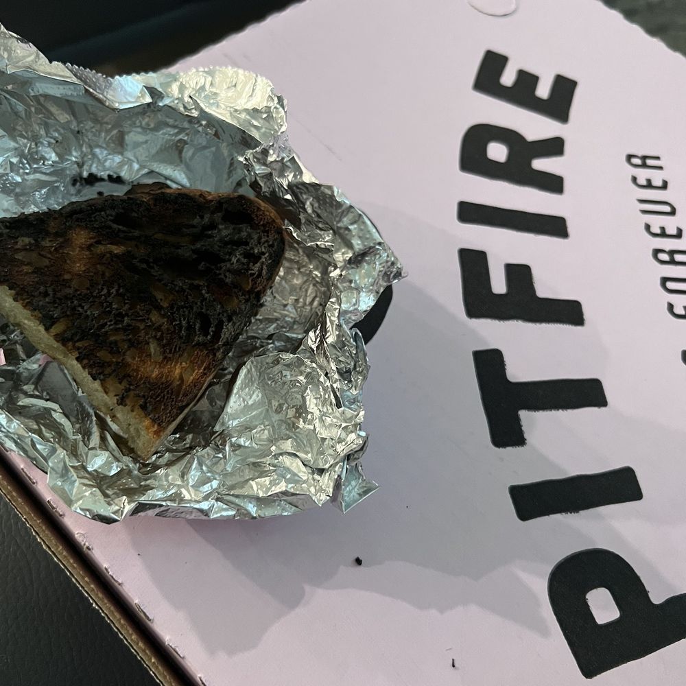 Pitfire Pizza - I'm guessing whoever packed this somehow didn't notice that this "bread" is now essentially a piece of charcoal. - Pizza Near Me - Carlsbad, California Pitfire Pizza - I'm guessing whoever packed this somehow didn't notice that this "bread" is now essentially a piece of charcoal. - Pizza Near Me - Carlsbad, California